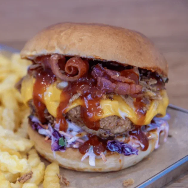 The BBQ fried chicken burger with BBQ sauce, coleslaw, bacon
