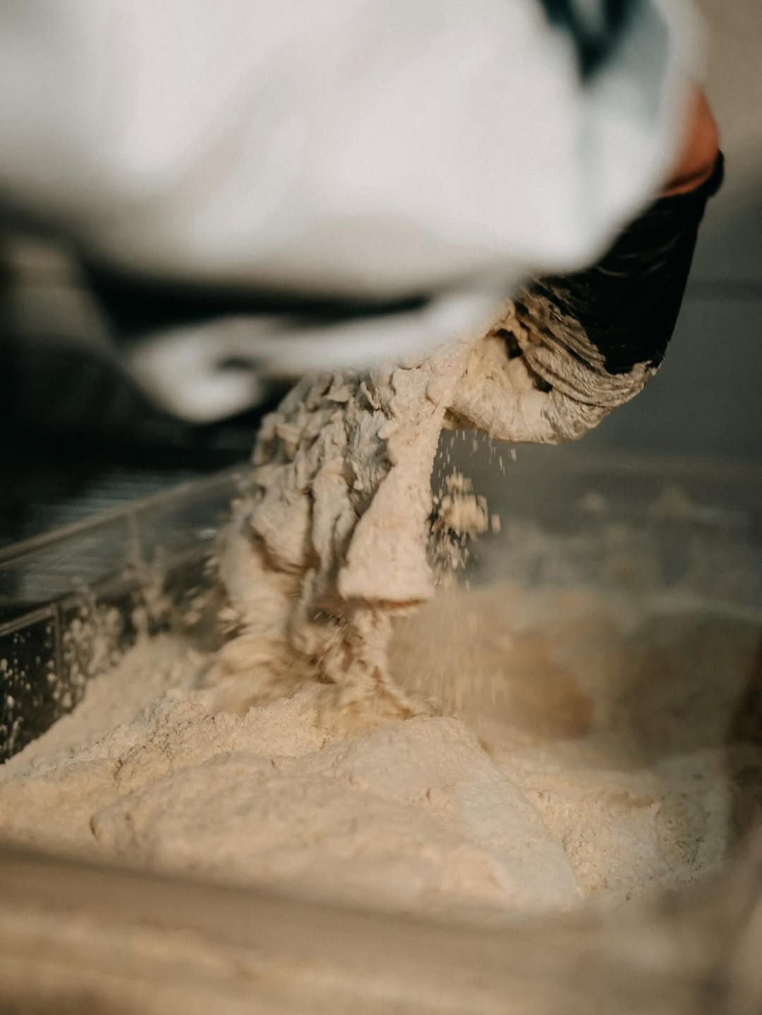 Chicken being hand-battered at KANA
